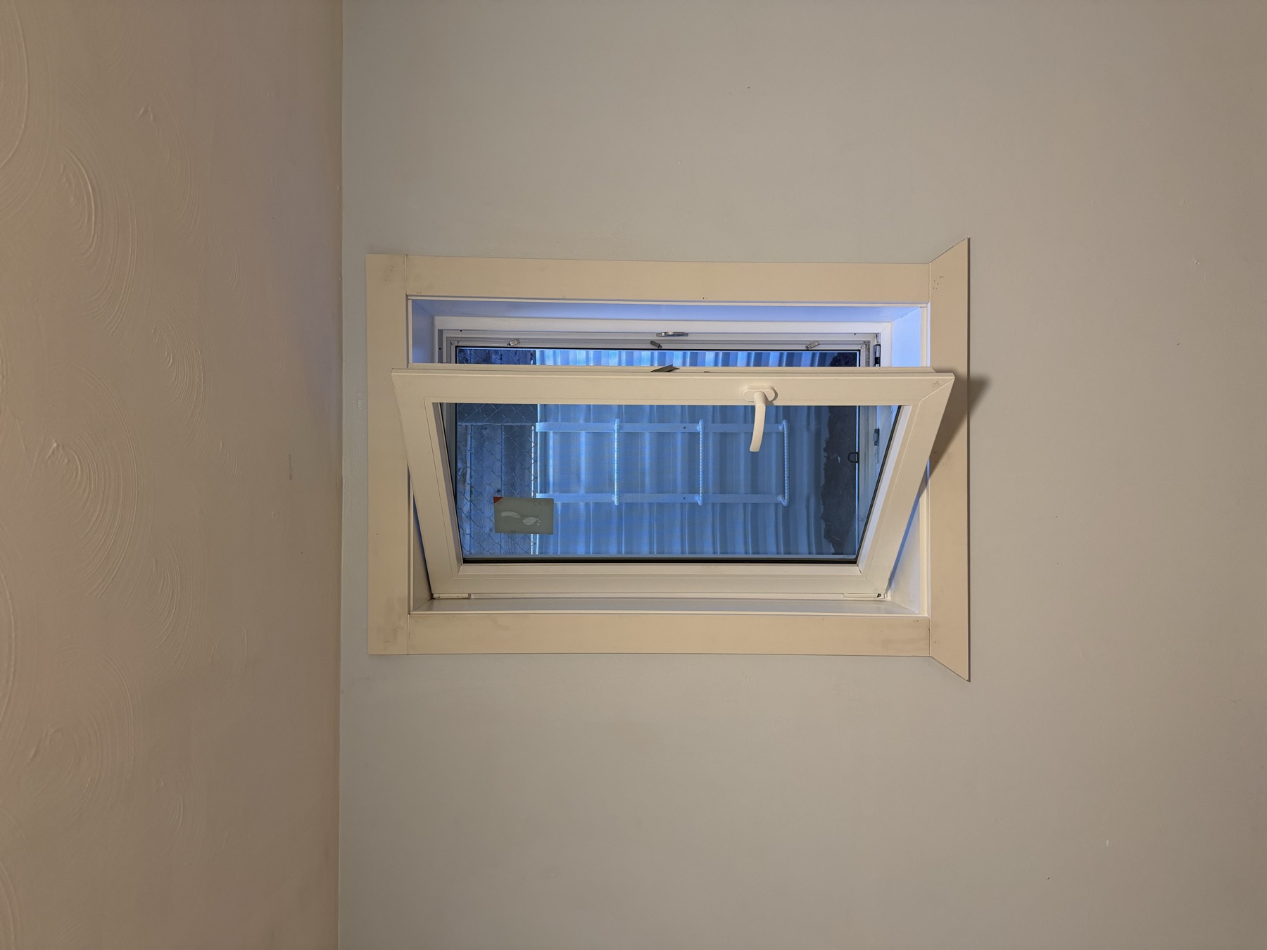 Basement egress window open interior view Denver